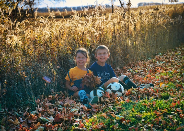 Jacob And Abigail Sitting In Leaves Edit 2 To Iphone