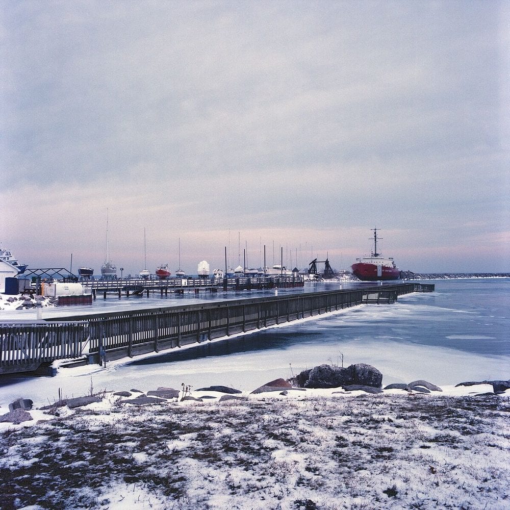 Ships at a frozen harbor